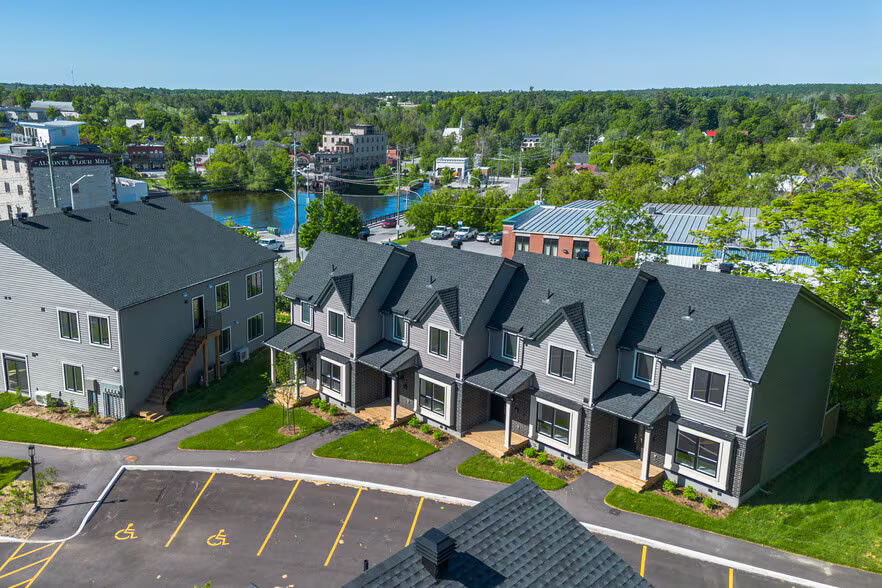 A top down view of some of the new rental townhomes showing parking spaces.